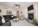 Cozy living room features a fireplace, plush seating, and ample natural light at 923 Woodcrest Way, Anderson, IN 46012