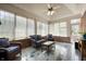 Bright sunroom with tile floor, vaulted ceilings, and wicker seating, filled with natural light at 923 Woodcrest Way, Anderson, IN 46012