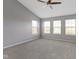 Spacious bedroom with neutral walls, carpet and multiple windows creating bright, natural light at 9417 Glencroft Way, Indianapolis, IN 46250