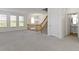 Large bonus room features neutral walls, gray carpeting, and plentiful natural light at 9417 Glencroft Way, Indianapolis, IN 46250