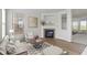 Cozy living room featuring a fireplace, modern furnishings, and a decorative rug at 9417 Glencroft Way, Indianapolis, IN 46250