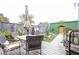 A backyard with a table and chairs, garden beds, and a wooden fence at 949 Harrison St, Indianapolis, IN 46202
