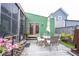 A backyard patio with seating, a grill, and a view of the garden at 949 Harrison St, Indianapolis, IN 46202