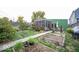 Landscaped backyard with a patio, garden, and lush greenery at 949 Harrison St, Indianapolis, IN 46202