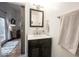 Charming bathroom featuring a sliding barn door, dark vanity, and contemporary fixtures at 949 Harrison St, Indianapolis, IN 46202
