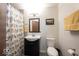 Cozy bathroom with pedestal sink, mirror, and decorative shower curtain for a touch of character at 949 Harrison St, Indianapolis, IN 46202