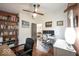 Bright home office featuring hardwood floors, white walls, and built-in shelving for optimal organization at 949 Harrison St, Indianapolis, IN 46202