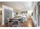 Bright kitchen with gray cabinets, stainless steel appliances, and a modern eat-in island and breakfast nook at 949 Harrison St, Indianapolis, IN 46202