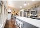 Open concept kitchen with gray cabinets, quartz countertops and hardwood floors with eat in nook at 949 Harrison St, Indianapolis, IN 46202