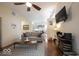 Cozy living room with hardwood floors, comfortable sofa, and a view into the modern eat in kitchen at 949 Harrison St, Indianapolis, IN 46202