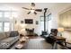 Bright and airy living room featuring a wood-burning stove, comfortable seating, and hardwood floors at 949 Harrison St, Indianapolis, IN 46202