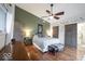 Stylish main bedroom featuring hardwood floors, barn doors, and a modern color scheme at 949 Harrison St, Indianapolis, IN 46202