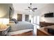 Spacious main bedroom with sliding barn doors, hardwood floors, and plenty of natural light at 949 Harrison St, Indianapolis, IN 46202