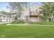 Charming backyard with a small patio and well-maintained lawn, perfect for outdoor enjoyment at 9553 Maple Way, Indianapolis, IN 46268