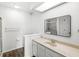 This bathroom features a walk-in shower, a large mirror and a neutral-toned vanity at 9553 Maple Way, Indianapolis, IN 46268