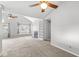 Bright living room with vaulted ceilings, fireplace, built-in shelving, and neutral carpet at 9553 Maple Way, Indianapolis, IN 46268