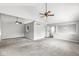 Spacious living room with vaulted ceiling, ceiling fans and neutral paint at 9553 Maple Way, Indianapolis, IN 46268
