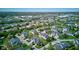 Beautiful view showcasing homes situated within a Primary-planned community with ponds, surrounded by mature trees and landscaping at 9602 Sweet Clover Way, Fishers, IN 46038