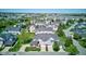 Scenic aerial view showcasing a well-planned residential area with manicured lawns, mature trees, and attractive homes at 9602 Sweet Clover Way, Fishers, IN 46038