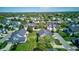 An aerial image featuring a well-maintained neighborhood with green spaces and beautifully landscaped yards at 9602 Sweet Clover Way, Fishers, IN 46038