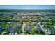 Beautiful aerial view of a Primary-planned community, highlighting houses and water features with lush greenery around the area at 9602 Sweet Clover Way, Fishers, IN 46038