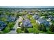 Picturesque aerial view of a residential area boasting well-maintained lawns, mature trees, and charming homes at 9602 Sweet Clover Way, Fishers, IN 46038