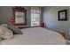 Bedroom featuring wooden furniture, a dresser, and a window with blinds at 9602 Sweet Clover Way, Fishers, IN 46038