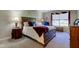 Bedroom with wooden furniture and a window with blinds at 9602 Sweet Clover Way, Fishers, IN 46038