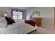 Bedroom with wooden dresser with decor and window with blinds at 9602 Sweet Clover Way, Fishers, IN 46038