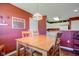This dining room offers hardwood floors, a wooden table, and abundant natural light at 9602 Sweet Clover Way, Fishers, IN 46038