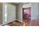 Entryway featuring hardwood floors with a white front door and sidelight at 9602 Sweet Clover Way, Fishers, IN 46038