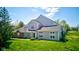 A well-manicured front yard complements this charming home's exterior, which features a two-story design and attached garage at 9602 Sweet Clover Way, Fishers, IN 46038