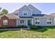 Charming two-story home with gray siding, brick accents, and well-maintained landscaping at 9602 Sweet Clover Way, Fishers, IN 46038