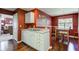 An efficient kitchen features stainless appliances, white cabinets, and hardwood floors at 9602 Sweet Clover Way, Fishers, IN 46038