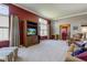 Open concept living room with views to adjoining rooms, neutral carpet, and natural light at 9602 Sweet Clover Way, Fishers, IN 46038