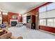 Bright living room with fireplace, large windows, and a spacious layout, perfect for entertaining and relaxing at 9602 Sweet Clover Way, Fishers, IN 46038
