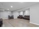 Finished basement features seating area with hardwood floors, perfect for entertaining or movie nights at 9656 Loganberry Ln, Indianapolis, IN 46256