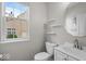 A half bathroom features a vanity and decorative shelves at 9656 Loganberry Ln, Indianapolis, IN 46256