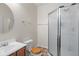 Bathroom features a standard white toilet and shower with glass doors and a wooden toilet seat at 9656 Loganberry Ln, Indianapolis, IN 46256