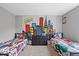 Shared bedroom with fun, colorful city-themed wallpaper, perfect for siblings or guests at 9656 Loganberry Ln, Indianapolis, IN 46256