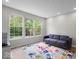 Cozy room with large windows and a colorful handprint rug at 9656 Loganberry Ln, Indianapolis, IN 46256