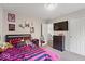 Well-decorated bedroom featuring stylish decor, a flat-screen TV, and ample closet space at 9656 Loganberry Ln, Indianapolis, IN 46256