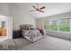 Spacious bedroom boasts vaulted ceilings, plush carpeting, and large windows with bright natural light at 9656 Loganberry Ln, Indianapolis, IN 46256