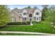 Charming two-story home with a well-manicured lawn and attractive landscaping at 9656 Loganberry Ln, Indianapolis, IN 46256