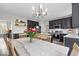 Spacious kitchen featuring dark cabinets, modern appliances, and a dining table at 9656 Loganberry Ln, Indianapolis, IN 46256