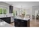 Bright kitchen featuring modern appliances, a kitchen island, and an adjacent dining area at 9656 Loganberry Ln, Indianapolis, IN 46256