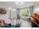 Bright living room with large windows, hardwood floors, and stylish furniture at 9656 Loganberry Ln, Indianapolis, IN 46256