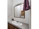 Bathroom featuring a laminate countertop with a sink and a wooden framed mirror at 9660 Old Haggard Rd, Morgantown, IN 46160