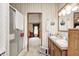 Bathroom with a dual sink vanity, walk-in shower, and doorway to another room at 9660 Old Haggard Rd, Morgantown, IN 46160