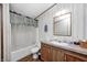 Bright bathroom with a tub and shower combination, vanity, and updated fixtures at 9660 Old Haggard Rd, Morgantown, IN 46160